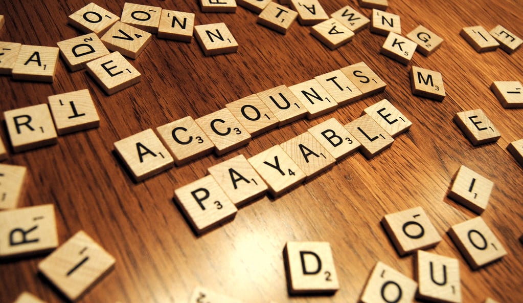 An scrabble featuring the text accounts payable