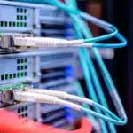 White and blue cables connecting a computer copy